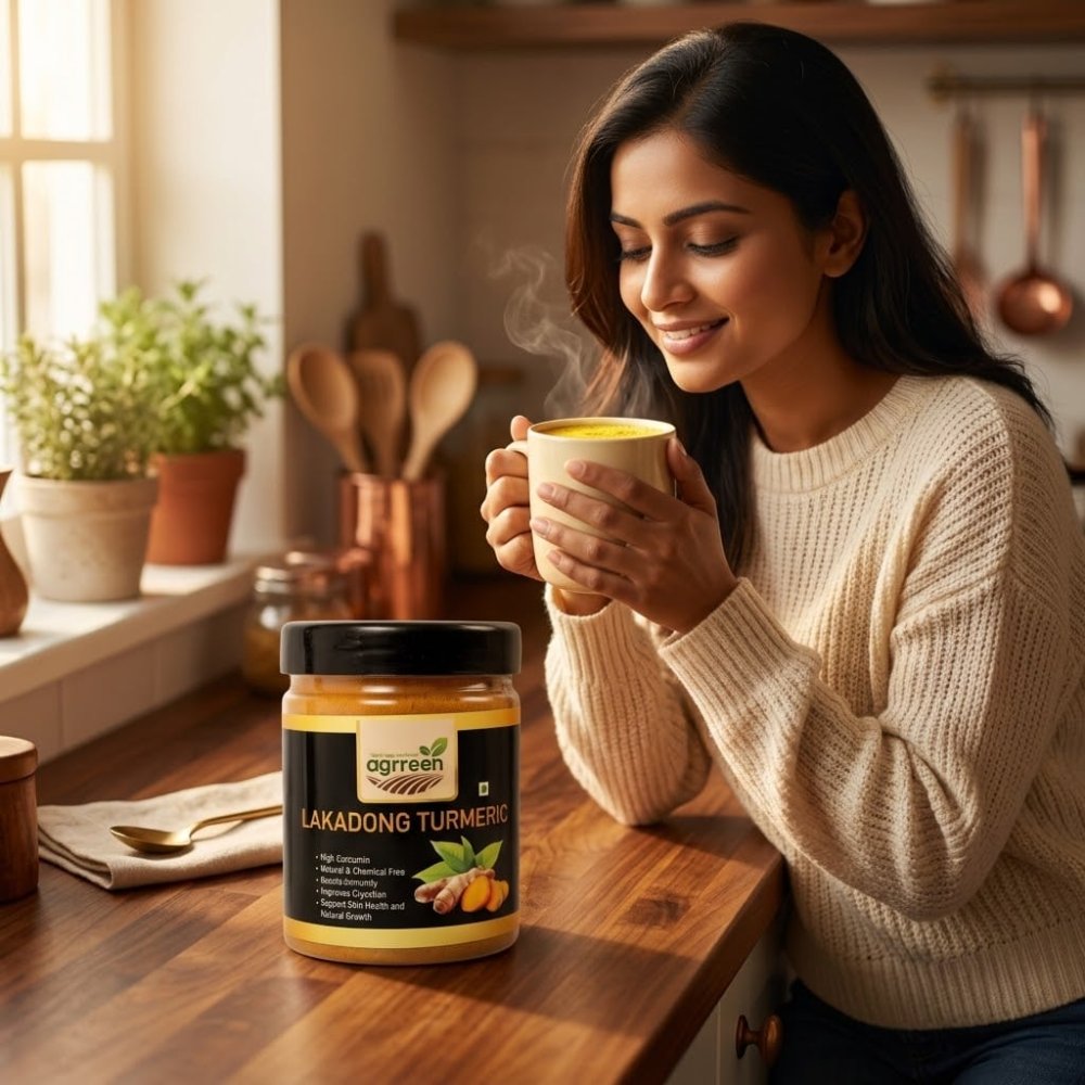 AGRREEN Lakadong Turmeric jar on a kitchen counter beside a cup of turmeric milk